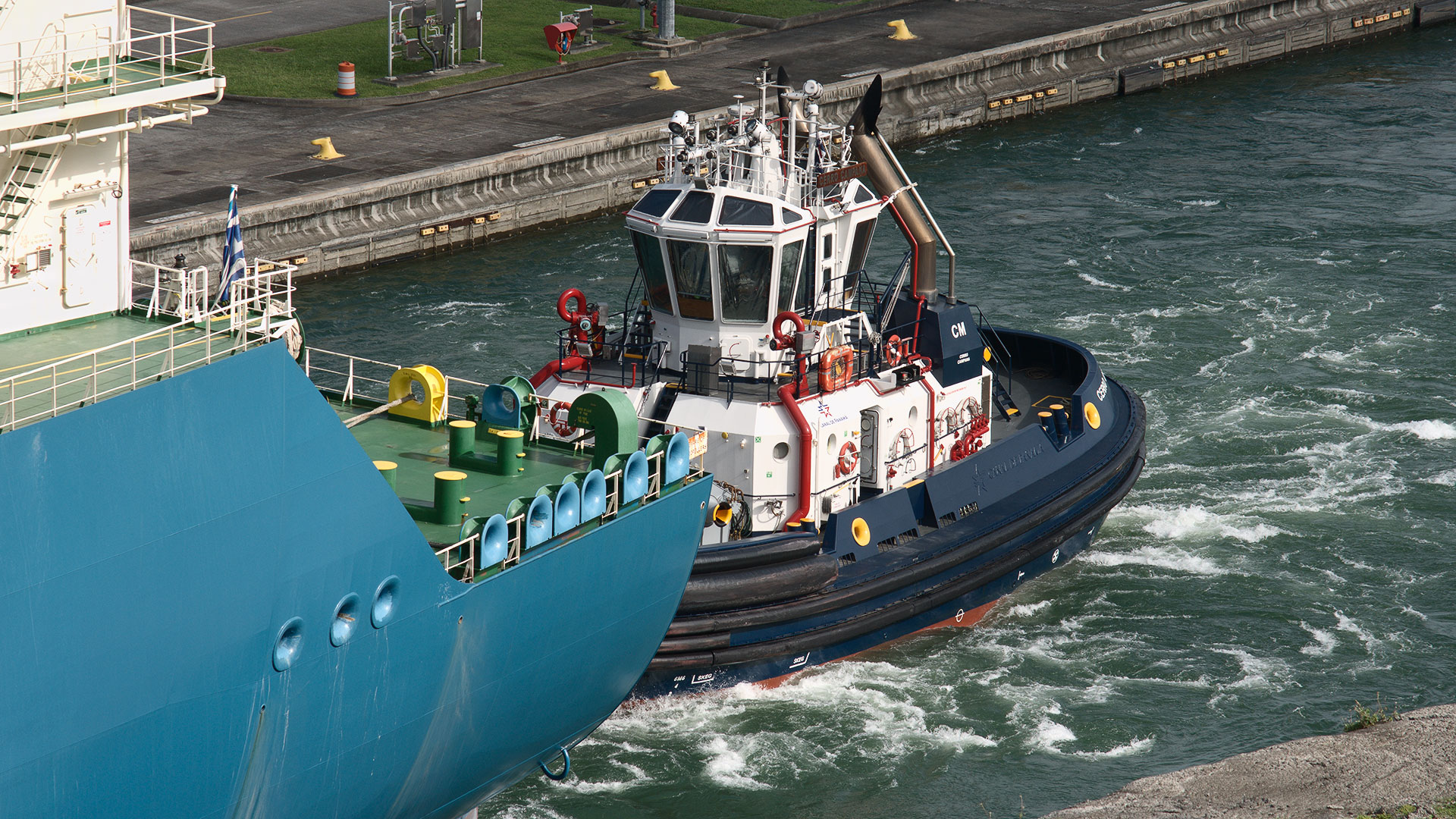 a tugboat departing from the agua clara locks in the panama canal